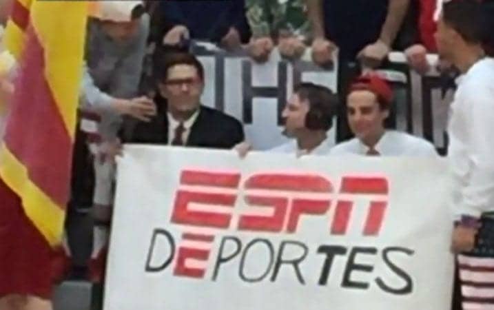 At a high school basketball game in Indiana between two Catholic schools last week, a group of students wearing patriotic clothing held up an "ESPN Deportes" and taunted Hispanic students and fans from the other school. (Image from CBS Chicago video)