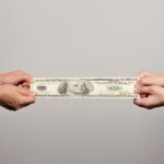 two pairs human hands stretching dollar bill shutterstock