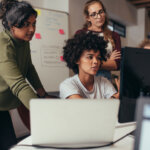 Women in tech solving problems.